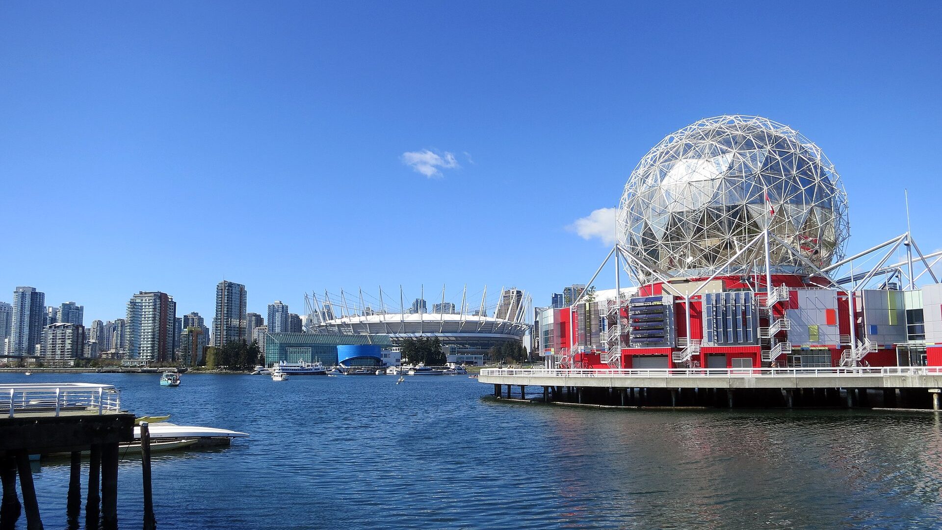 The geodesic dome of Science World above False Creek, Vancouver